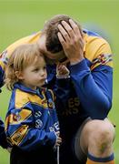 17 March 2010; Portumna goalkeeper Ivan Canning with his son Andrew, age 3, after defeat in the final. AIB GAA Hurling All-Ireland Senior Club Championship Final, Ballyhale Shamrocks v Portumna, Croke Park, Dublin. Picture credit: Brian Lawless / SPORTSFILE