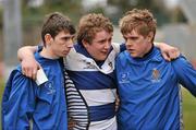 17 March 2010; A dejected Richard Moran, Rockwell College, centre, is supported by team-mates Ryan Murtagh, left, and MJ Murphy after defeat to PBC. Munster Schools Senior Cup Final, Rockwell College v PBC, Thomond Park, Limerick. Picture credit: Diarmuid Greene / SPORTSFILE