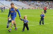 17 March 2010; Portumna goalkeeper Ivan Canning leaves the pitch after the game with his sons Andrew, age 3, and Nathan, age 5. AIB GAA Hurling All-Ireland Senior Club Championship Final, Ballyhale Shamrocks v Portumna, Croke Park, Dublin. Picture credit: Brendan Moran / SPORTSFILE