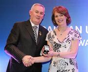 16 March 2009; Mary Donohue, Harps Camogie Club, Co. Laois, is presented with a GAA President's Award by Uachtarán CLG Criostóir Ó Cuana.The Harps Camogie Club was founded in 1995 and Mary has been with it every step of the way. As well as fulfilling officer roles, she is ceaseless in fundraising and seeking out sponsors. GAA President’s Awards 2010, Croke Park, Dublin. Picture credit: Brendan Moran / SPORTSFILE