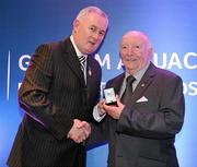 17 March 2009; Harry Mc Evoy, Carryduff GAC, Down, is presented with a GAA President's Award by Uachtarán CLG Criostóir Ó Cuana. Harry was a founder member of Dumaness and Carryduff and also served as Secretary and Chairman of the East Down Divisional Committee. He has been deeply involved in the promotion and presentation of Scór at the county, provincial and central level. GAA President’s Awards 2010, Croke Park, Dublin. Picture credit: Brendan Moran / SPORTSFILE
