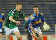 18 March 2010; Peter Acheson, Tipperary, in action against Tony McMahon, Limerick. Cadbury Munster GAA Football Under 21 Championship Semi-Final, Tipperary v Limerick, Semple Stadium, Thurles, Co. Tipperary. Picture credit: Diarmuid Greene / SPORTSFILE