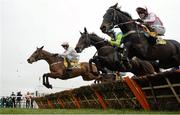 18 March 2016; A general view of runners and riders in the the JCB Triumph Hurdle including, from right, Who Dares Wins, with Richard Johnson up, Clan Des Obeaux, with Noel Fehily up, and Let's Dance, with Paul Townend up. Prestbury Park, Cheltenham, Gloucestershire, England. Picture credit: Cody Glenn / SPORTSFILE