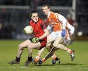 20 March 2010; Conor Garvey, Down, in action against Joe Feeney, Armagh. Allianz GAA National Football League, Down v Armagh, Division 2, Round 5, Pairc Esler, Newry, Co. Down. Picture credit: Oliver McVeigh / SPORTSFILE