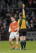 20 March 2010; Referee Martin Sludden shows a yellow card to Ciarran McKeever, Armagh. Allianz GAA National Football League, Down v Armagh, Division 2, Round 5, Pairc Esler, Newry, Co. Down. Picture credit: Oliver McVeigh / SPORTSFILE