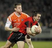 20 March 2010; Mark Poland, Down, in action against Kieran Toner, Armagh. Allianz GAA National Football League, Down v Armagh, Division 2, Round 5, Pairc Esler, Newry, Co. Down. Picture credit: Oliver McVeigh / SPORTSFILE