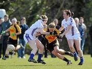 21 March 2010; Orlagh Egan, NUI Maynooth, in action against Bridin Doyle, left, and Anne Marie O'Gorman, WIT. Giles Cup Final, NUI Maynooth v Waterford IT, St Clare's, DCU, Ballymun, Dublin. Picture credit: Brian Lawless / SPORTSFILE