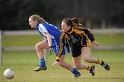 21 March 2010; Niamh Lohan, Mary Immaculate College Limerick, in action against Kate Cumiskey, DCU 2. Lynch Cup Final, DCU 2 v Mary Immaculate College, St Clare's, DCU, Ballymun, Dublin. Picture credit: David Maher / SPORTSFILE