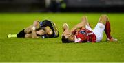 24 March 2016; Graham Kelly, St Patrick's Athletic, and Ronan Finn, Dundalk, lie injured after clashing heads. SSE Airtricity League Premier Division, St Patrick's Athletic v Dundalk. Richmond Park, Dublin. Picture credit: Seb Daly / SPORTSFILE