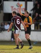 21 March 2010; Referee Aidan Mangan issues one of six yellow cards to Westmeath's Francis Boyle. Allianz GAA National Football League, Division 2, Round 5, Kildare v Westmeath, St Conleth's Park, Newbridge, Co. Kildare. Picture credit: Ray McManus / SPORTSFILE