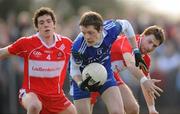 21 March 2010; Conor McManus, Monaghan, in action against Dermot McBride, left, and Gerard O'Kane, Derry. Allianz GAA National Football League, Division 1, Round 5, Monaghan v Derry, St Mary's Park, Scotstown, Co. Monaghan. Photo by Sportsfile
