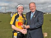 21 March 2010; Michelle Carey, NUI Maynooth, is presented with the player of the match award by  Pat Quill, Uachtarán Cumann Peil Gael na mBan. Giles Cup Final, NUI Maynooth v Waterford IT, St Clare's, DCU, Ballymun, Dublin. Picture credit: Brian Lawless / SPORTSFILE