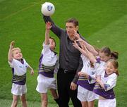 23 March 2010; Kildare football manager Kieran McGeeney with Michael Donovan, left, Luke Browne, Sarah O'Neill, Laura Byrne and Johanne Byrne, right, at the launch of the 2010 Vhi GAA Cúl Camps. Croke Park, Dublin. Picture credit: Ray McManus / SPORTSFILE