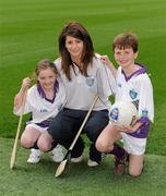 23 March 2010; Wexford camogie player Mags D'Arcy with Laura Byrne and Luke Browne at the launch of the 2010 Vhi GAA Cúl Camps. Croke Park, Dublin. Picture credit: Ray McManus / SPORTSFILE