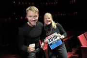 24 March 2010; Ronan Keating confirms entry to SPAR Great Ireland Run! When his sell-out world tour came to Dublin this week, singing superstar Ronan Keating took the time to receive his race number for this year's SPAR Great Ireland Run from his sister Linda, Fundraising Director of the Marie Keating Foundation, one of the Run's supported charities. Ronan's tour winds up in Malta on April 3rd and after a short family break he will be fit and raring to go in the Run on Sunday April 18th in the Phoenix Park. 8,000 people have already signed up for Ireland's fastest growing running event with entries available on-line at www.greatirelandrun.org or by calling 1890 930 139. All entrants will receive a technical T-shirt before the event. Other charities supported by the event are Our Lady's Hospice, Harold's Cross and the SPAR Charity of the Year, 3Ts -Turn the Tide of  Suicide. The SPAR Great Ireland Run will be shown live on RTE Two. Pictured at the Great Ireland Run photocall is Ronan Keating with his sister Linda Keating. Grand Canal Theatre, Grand Canal Square, Docklands, Dublin. Picture credit: Brian Lawless / SPORTSFILE