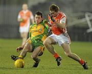 24 March 2010; Mark McHugh, Donegal, in action against Mark McConville, Armagh. Cadbury Ulster GAA Football Under 21 Quarter-Final, Armagh v Donegal, Brewster Park, Enniskillen, Co. Fermanagh. Picture credit: Oliver McVeigh / SPORTSFILE