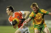 24 March 2010; Mark Shields, Armagh, in action against Daniel McLaughlin, Donegal. Cadbury Ulster GAA Football Under 21 Quarter-Final, Armagh v Donegal, Brewster Park, Enniskillen, Co. Fermanagh. Picture credit: Oliver McVeigh / SPORTSFILE