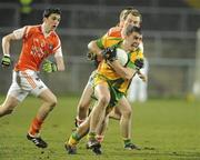 24 March 2010; Kevin Mulhern, Donegal, in action against Kieran Hoey, Armagh. Cadbury Ulster GAA Football Under 21 Quarter-Final, Armagh v Donegal, Brewster Park, Enniskillen, Co. Fermanagh. Picture credit: Oliver McVeigh / SPORTSFILE