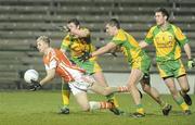 24 March 2010; Francis Hanratty, Armagh, in action against Leo McLoone and Kevin Mulhern, Donegal. Cadbury Ulster GAA Football Under 21 Quarter-Final, Armagh v Donegal, Brewster Park, Enniskillen, Co. Fermanagh. Picture credit: Oliver McVeigh / SPORTSFILE