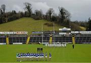 27 March 2016; Both teams stand for the National Anthem. Allianz Football League Division 2 Round 6, Cavan v Laois. Kingspan Breffni Park, Cavan.  Picture credit: Ramsey Cardy / SPORTSFILE