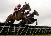 27 March 2016; Eventual winner Acapella Bourgeois, left, with Jonathan Burke up, clears the final hurdle alongside Nambour, with Bryan Cooper up, on their way to winning the Agnelli Motor Park Novice Hurdle. Horse Racing at the Fairyhouse Easter Festival. Fairyhouse, Co. Meath. Picture credit: Cody Glenn / SPORTSFILE
