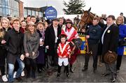 27 March 2016; Jonathan Burke, in the winners enclosure with Acapella Bourgeois, look-a-like Matthew Boisse, age 6, a grandson of syndicate owners from Slaneyville Syndicate, and all the winning connections after winning the Agnelli Motor Park Novice Hurdle. Horse Racing at the Fairyhouse Easter Festival. Fairyhouse, Co. Meath. Picture credit: Cody Glenn / SPORTSFILE