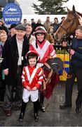 27 March 2016; Jonathan Burke, in the winners enclosure with Acapella Bourgeois and look-a-like Matthew Boisse, age 6, a grandson of syndicate owners from Slaneyville Syndicate after winning the Agnelli Motor Park Novice Hurdle. Horse Racing at the Fairyhouse Easter Festival. Fairyhouse, Co. Meath. Picture credit: Cody Glenn / SPORTSFILE
