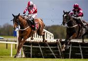 27 March 2016; Eventual winner Acapella Bourgeois, left, with Jonathan Burke up, jumps the final hurdle alongside Nambour, with Bryan Cooper up, on their way to winning the Agnelli Motor Park Novice Hurdle. Horse Racing at the Fairyhouse Easter Festival. Fairyhouse, Co. Meath. Picture credit: Cody Glenn / SPORTSFILE