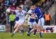 27 March 2016; David Givney, Cavan, is tackled by Mark Timmons, Laois. Allianz Football League Division 2 Round 6, Cavan v Laois. Kingspan Breffni Park, Cavan.  Picture credit: Ramsey Cardy / SPORTSFILE