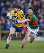 27 March 2016; Cathal Cregg, Roscommon, in action against Brendan Harrison, Mayo. Allianz Football League Division 1 Round 6, Roscommon v Mayo. Dr Hyde Park, Roscommon.  Picture credit: Brendan Moran / SPORTSFILE