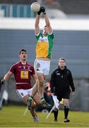 27 March 2016; Jason Gethings, Offaly, jumps high to keep the ball from going out of play. Allianz Football League Division 3 Round 6, Westmeath v Offaly. TEG Cusack Park, Mullingar, Co. Westmeath. Picture credit: Seb Daly / SPORTSFILE