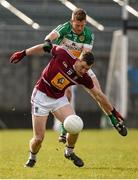 27 March 2016; Alan Stone of Westmeath in action against Brian Darby of Offaly during the Allianz Football League Division 3 Round 6 match between Westmeath and Offaly at TEG Cusack Park in Mullingar, Co. Westmeath. Photo by Seb Daly/Sportsfile