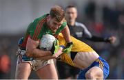 27 March 2016; Aidan O'Shea, Mayo, is tackled by Conor Devaney, Roscommon. Allianz Football League Division 1 Round 6, Roscommon v Mayo. Dr Hyde Park, Roscommon.  Picture credit: Brendan Moran / SPORTSFILE