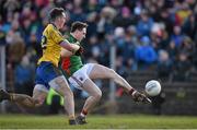 27 March 2016; Shane Nally, Mayo, has a shot on goal despite the best efforts of John McManus, Roscommon. Allianz Football League Division 1 Round 6, Roscommon v Mayo. Dr Hyde Park, Roscommon.  Picture credit: Brendan Moran / SPORTSFILE