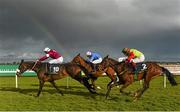 27 March 2016; A general view of runners and riders racing past a rainbow in the Tattersalls Ireland George Mernagh Memorial Sales Bumper including, from front, Narcissistic, with Jamie Codd up, Manners Legend, with Richard Harding up, and Art Of Supremacy, with Jason McKeown up. Horse Racing at the Fairyhouse Easter Festival. Fairyhouse, Co. Meath. Picture credit: Cody Glenn / SPORTSFILE