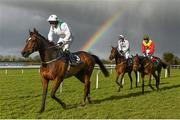27 March 2016; A general view of runners and riders passing by a rainbow after the Tattersalls Ireland George Mernagh Memorial Sales Bumper including, from front, Blairs Cove, with Jane Mangan up, Calicojack, with Nina Carberry up, and Moscow River, with Steven Crawford up. Horse Racing at the Fairyhouse Easter Festival. Fairyhouse, Co. Meath. Picture credit: Cody Glenn / SPORTSFILE