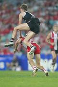 27 March 2010; Sydney Swans' Tadhg Kennelly in action against Zac Dawson, St. Kilda. This tackle led to Tadhg Kennelly needing treatment after being knocked out in the final quarter. Australian Football League Premiership, Round 1, Sydney Swans v St. Kilda, ANZ Stadium, Sydney, Australia. Picture credit: Jenny Evans / SPORTSFILE