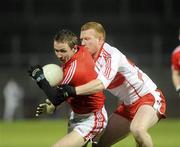 27 March 2010; John Hayes, Cork, in action against Fergal Doherty, Derry. Allianz GAA Football National League, Division 1, Round 6, Derry v Cork, Celtic Park, Derry. Picture credit: Oliver McVeigh / SPORTSFILE