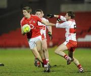 27 March 2010; Aidan Walsh, Cork, in action against Gerard O'Kane, Derry. Allianz GAA Football National League, Division 1, Round 6, Derry v Cork, Celtic Park, Derry. Picture credit: Oliver McVeigh / SPORTSFILE