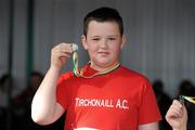 27 March 2010; Thomas McGowan, Tir Chonaill AC, with his medal after winning the Boys U13 Shot Putt at the Woodie’s DIY Juvenile Indoor Championships. Nenagh Indoor Arena, Nenagh, Co. Tipperary. Picture credit: Pat Murphy / SPORTSFILE