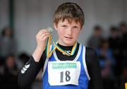 27 March 2010; Conor Diskin, Claremorris AC, with his medal after winning the Boys U13 Long Jump at the Woodie’s DIY Juvenile Indoor Championships. Nenagh Indoor Arena, Nenagh, Co. Tipperary. Picture credit: Pat Murphy / SPORTSFILE