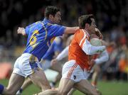 28 March 2010; Aaron Kernan, Armagh, in action against Robbie Costigan, Tipperary. Allianz GAA Football National League, Division 2, Round 6, Armagh v Tipperary, St Oliver Plunkett Park, Crossmaglen, Armagh. Picture credit: Oliver McVeigh / SPORTSFILE