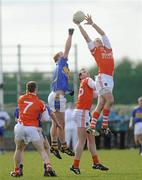 28 March 2010; Gareth Swift, Armagh, in action against George Hannigan, Tipperary. Allianz GAA Football National League, Division 2, Round 6, Armagh v Tipperary, St Oliver Plunkett Park, Crossmaglen, Armagh. Picture credit: Oliver McVeigh / SPORTSFILE