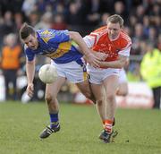 28 March 2010; Barry Grogan, Tipperary, in action against Paul Duffy, Armagh. Allianz GAA Football National League, Division 2, Round 6, Armagh v Tipperary, St Oliver Plunkett Park, Crossmaglen, Armagh. Picture credit: Oliver McVeigh / SPORTSFILE