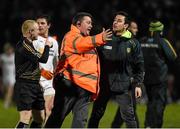 30 March 2016; A Celtic Park steward intervenes between a Donegal official and referee Barry Cassidy. EirGrid Ulster GAA Football U21 Championship, Semi-Final, Tyrone v Donegal, Celtic Park, Derry. Picture credit: Oliver McVeigh / SPORTSFILE