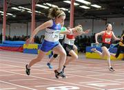 27 March 2010; Grace Lawlor, St. Laurence O'Tooles AC, left, crosses the finish line to win the Girls U14 60m at the Woodie’s DIY Juvenile Indoor Championships. Nenagh Indoor Arena, Nenagh, Co. Tipperary. Picture credit: Pat Murphy / SPORTSFILE