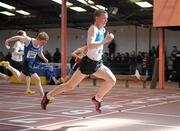 27 March 2010; Marcus Lawlor, St. Laurence O'Toole AC, crosses the finish line to win the U16 Boys 60m final at the Woodie’s DIY Juvenile Indoor Championships. Nenagh Indoor Arena, Nenagh, Co. Tipperary. Picture credit: Pat Murphy / SPORTSFILE