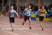 27 March 2010; Lorcan O'Cathain, Roscommon AC, crosses the finish line ahead of second placed Mark Kavanagh, Dundrum South Dublin AC, centre, and third placed Edmond O'Halloran, Leevale AC, right, to win the the Boys U19 60m Final during the Woodie’s DIY Juvenile Indoor Championships. Nenagh Indoor Arena, Nenagh, Co. Tipperary. Picture credit: Pat Murphy / SPORTSFILE