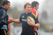 30 March 2010; Munster's Jerry Flannery with team-mate Alan Quinlan during squad training ahead of their Celtic League match against Leinster on Friday. Clanwilliam RFC, Murgasty, Tipperary, Co. Tipperary. Picture credit: Brian Lawless / SPORTSFILE