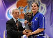 27 March 2010; Team Montenotte Hotel Cork captain Marie breen is presented with the Women's Superleague trophy by Timmy Murphy, President, Basketball Ireland. IrishSport.TV Women’s SuperLeague Final, Team Montenotte Hotel Cork v DCU Mercy, National Basketball Arena, Tallaght, Dublin. Picture credit: Brendan Moran / SPORTSFILE